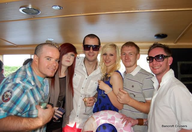 Guests enjoying a summer party cruise on the River Avon
