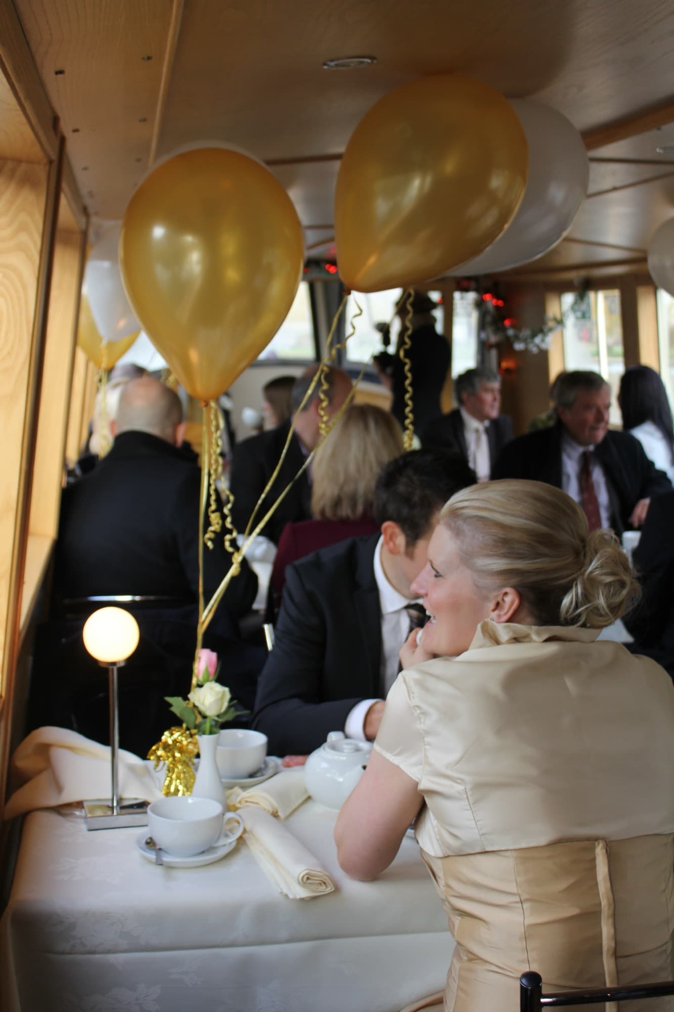 A wedding reception laid out aboard The Rita Ellen with flowers and champagne